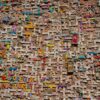 Vibrant tile mosaic on a wall showcasing letters and words in Gyumri, Armenia.