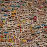Vibrant tile mosaic on a wall showcasing letters and words in Gyumri, Armenia.